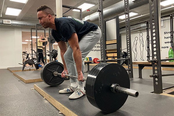 logan at the start of a 405 deadlift