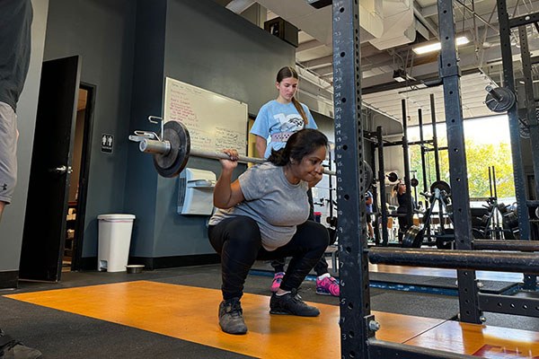 ramya at the bottom of a squat