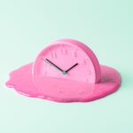 The,Pink,Clock,Melts,Against,The,Birch,Background.,Creative,Concept