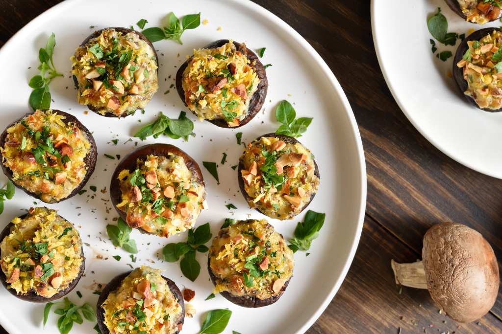 stuffed mushrooms with cheese, spinach and feta on plate