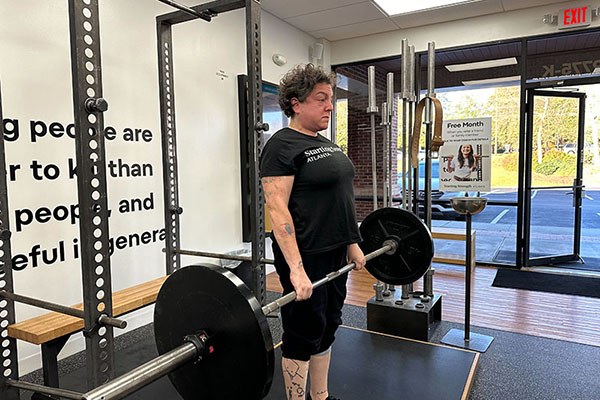 molly deadlifting one plate