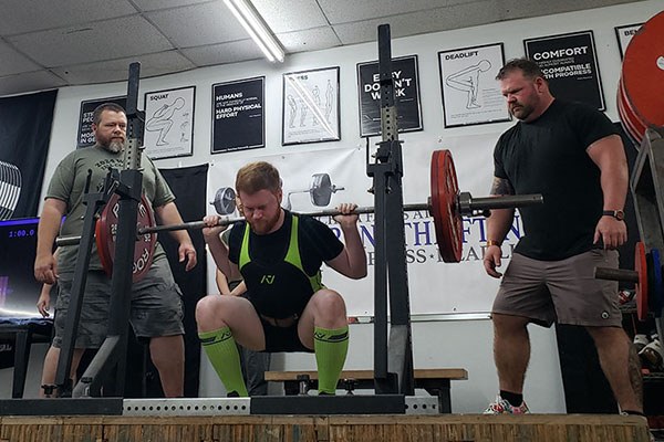 lifter at the bottom of a squat