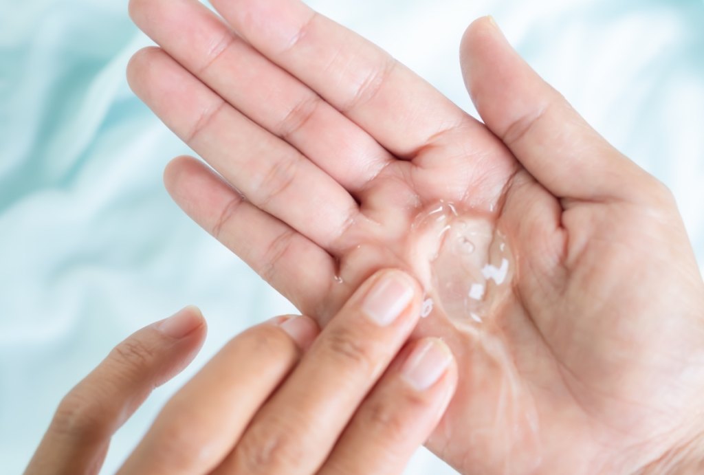 A dollop of lubricant in a woman's hand, which can keep the vagina pH balanced