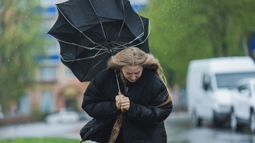 Woman in heavy rain