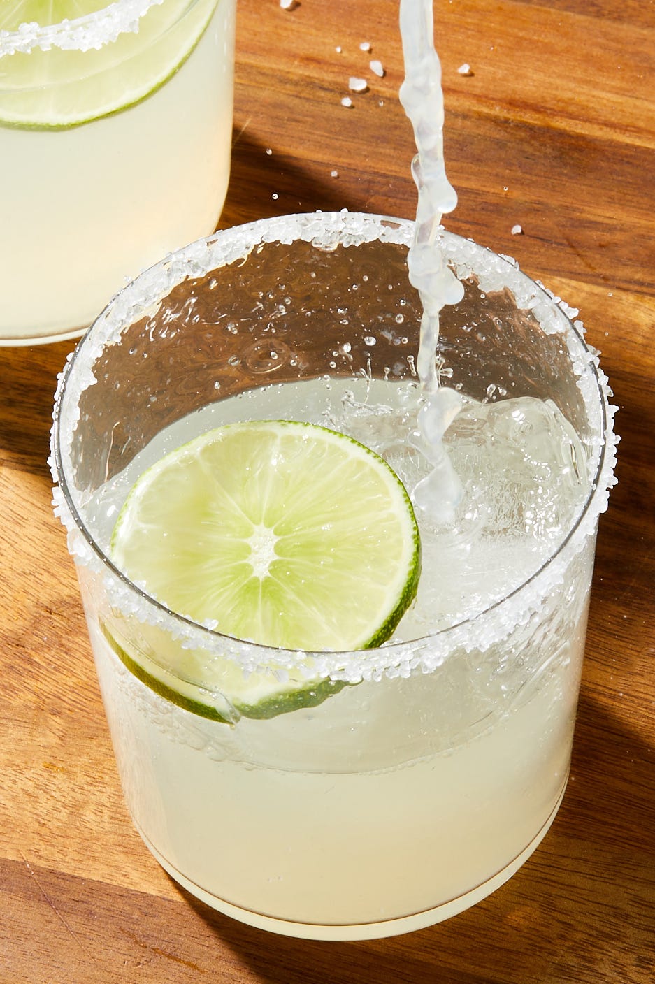 classic margaritas with a salt rim and lime garnish