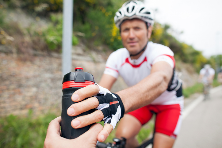 Cyclists Receives Drink During Event | During Event