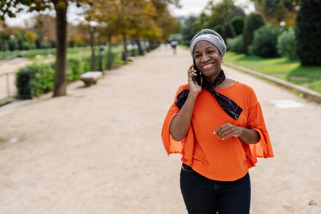 woman outside on the phone walking for weight loss