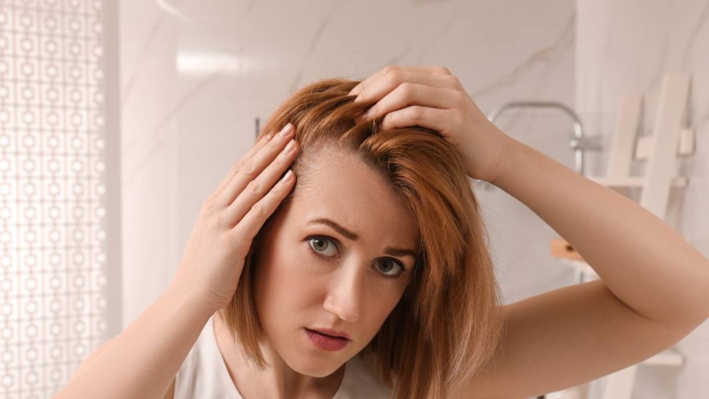 Woman looking at scalp