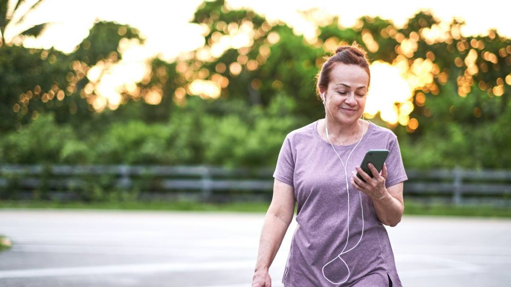 Woman listening to playlist while walking