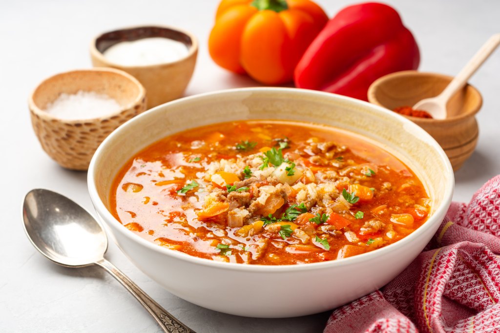 stuffed pepper in bowl with ingredients in background