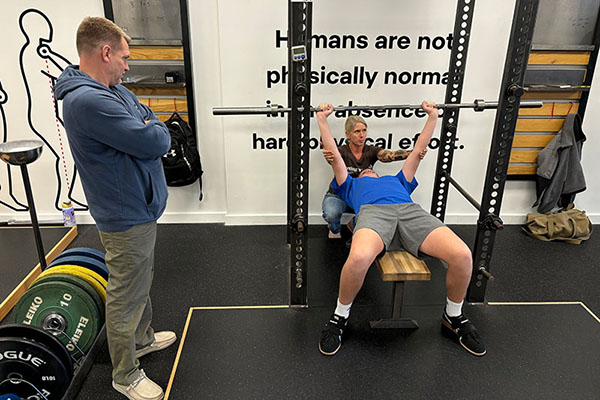 reid learning how to bench press