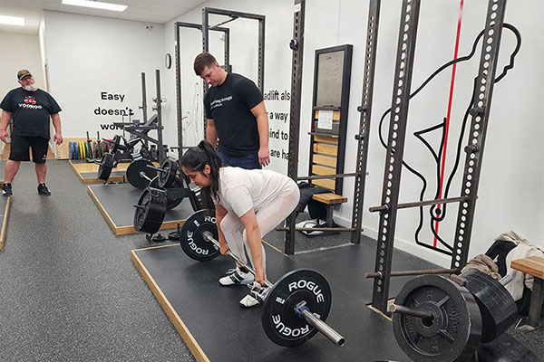 malliki sets up for a deadlift at starting strength columbus