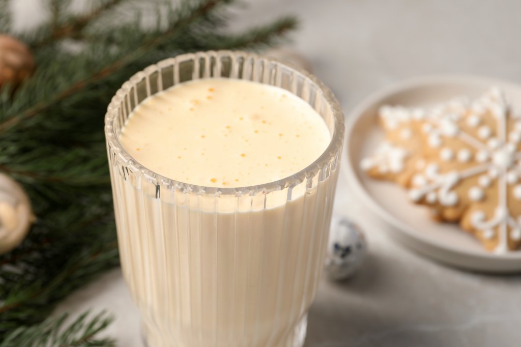 A glass of homemade eggnog as part of a guide on addressing the question, 