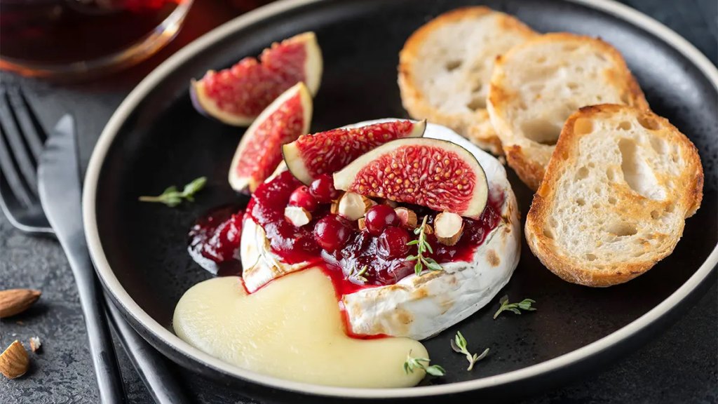 Baked Brie as part of a recipe roundup of New Year's Eve appetizers