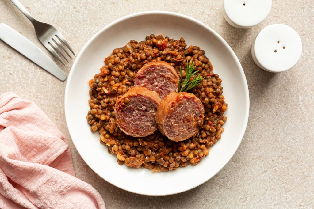 Cotechino con lenticchie (an Italian lentil dish) as part of a roundup of lucky New Year's food traditions