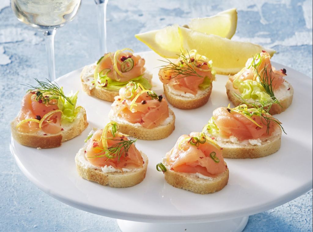 Herby smoked salmon bites as part of a recipe roundup of New Year's Eve appetizers