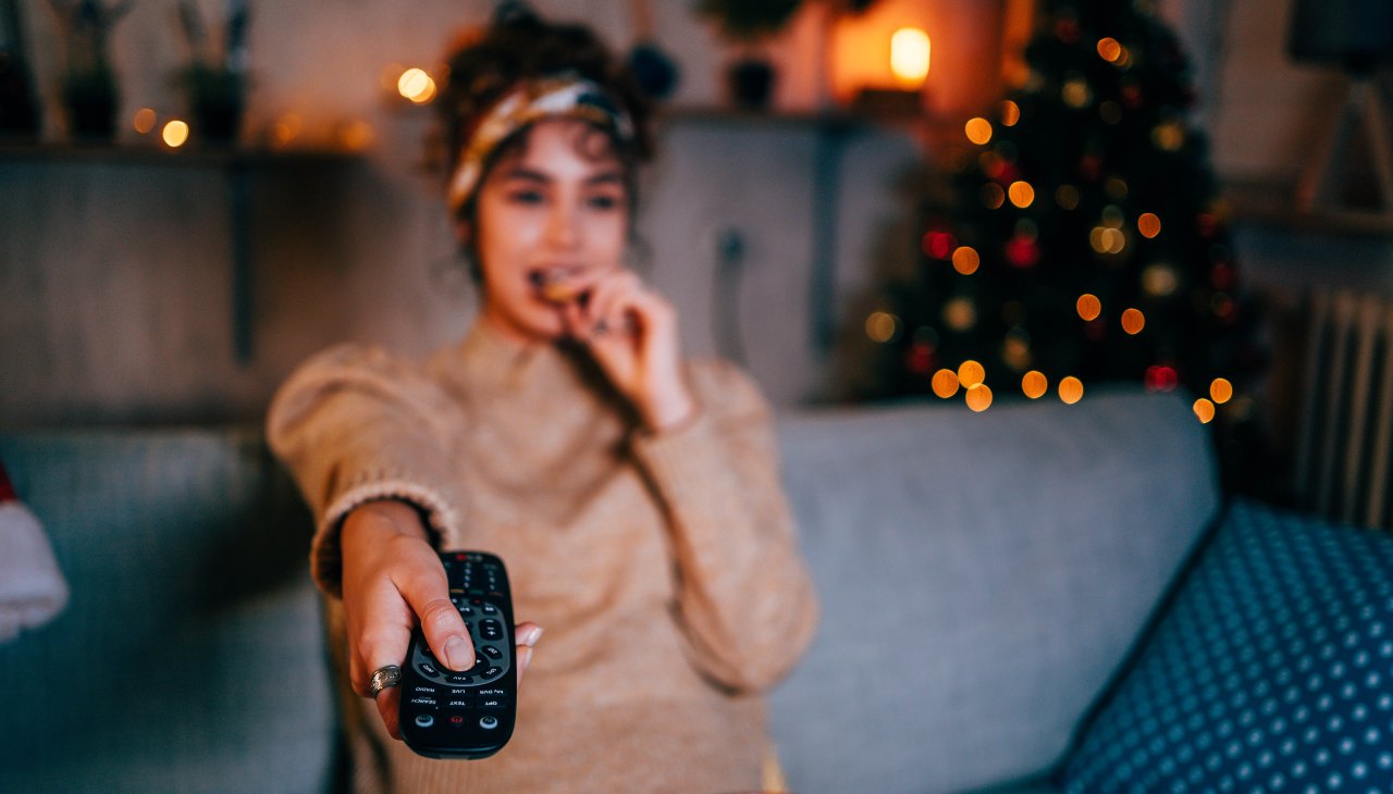 Woman watching tv at home