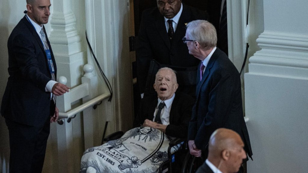 Former US President Jimmy Carter arrives at a tribute service for his wife Rosalynn Carter at Glenn Memorial Church in Atlanta, Georgia, on November 28, 2023