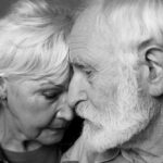 Close,Up,Black-and-white,Portrait,Of,Grey-haired,Man,And,Woman,Standing