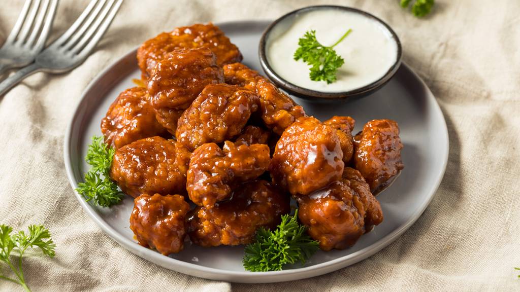 Boneless chicken wings tossed in BBQ sauce