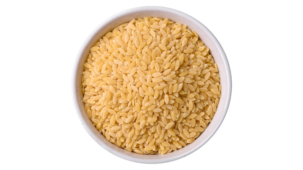 Raw, whole grained orzo