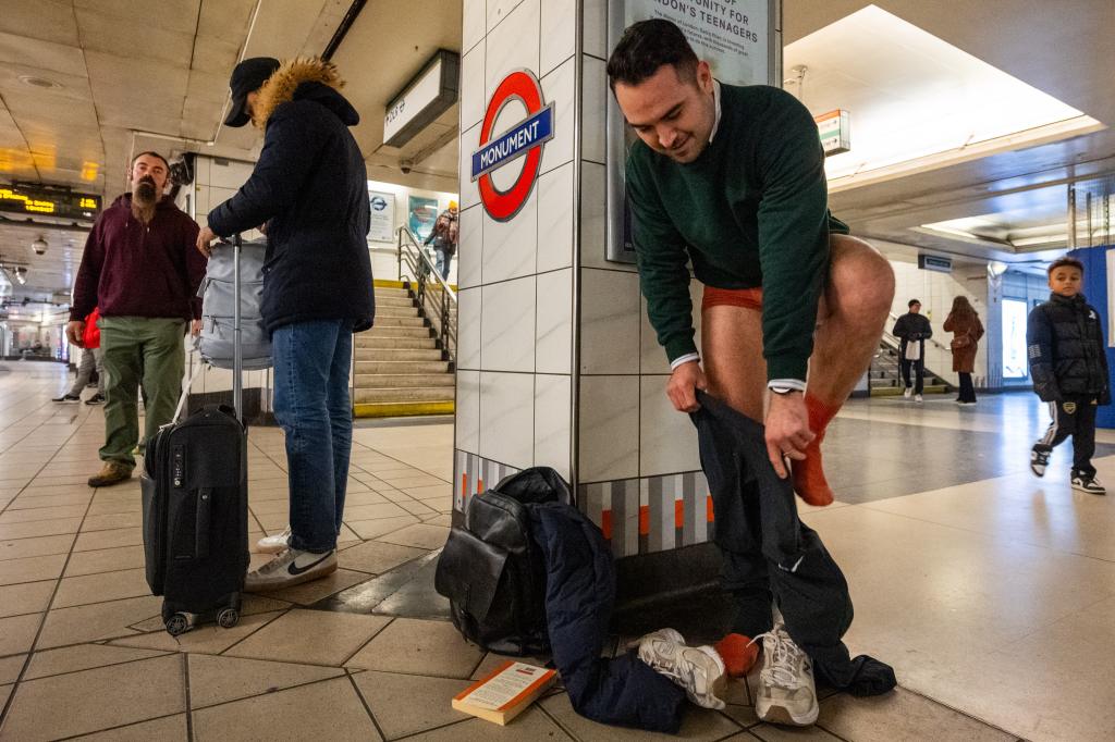 Man pulling off pants for No Trousers Tube Ride 2025