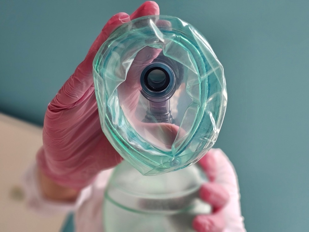 Anesthesia mask is lowered, closeup, top-down view.