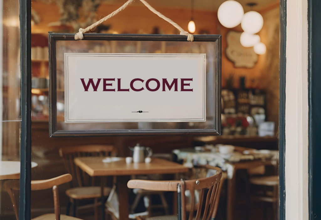 Welcome sign in café window