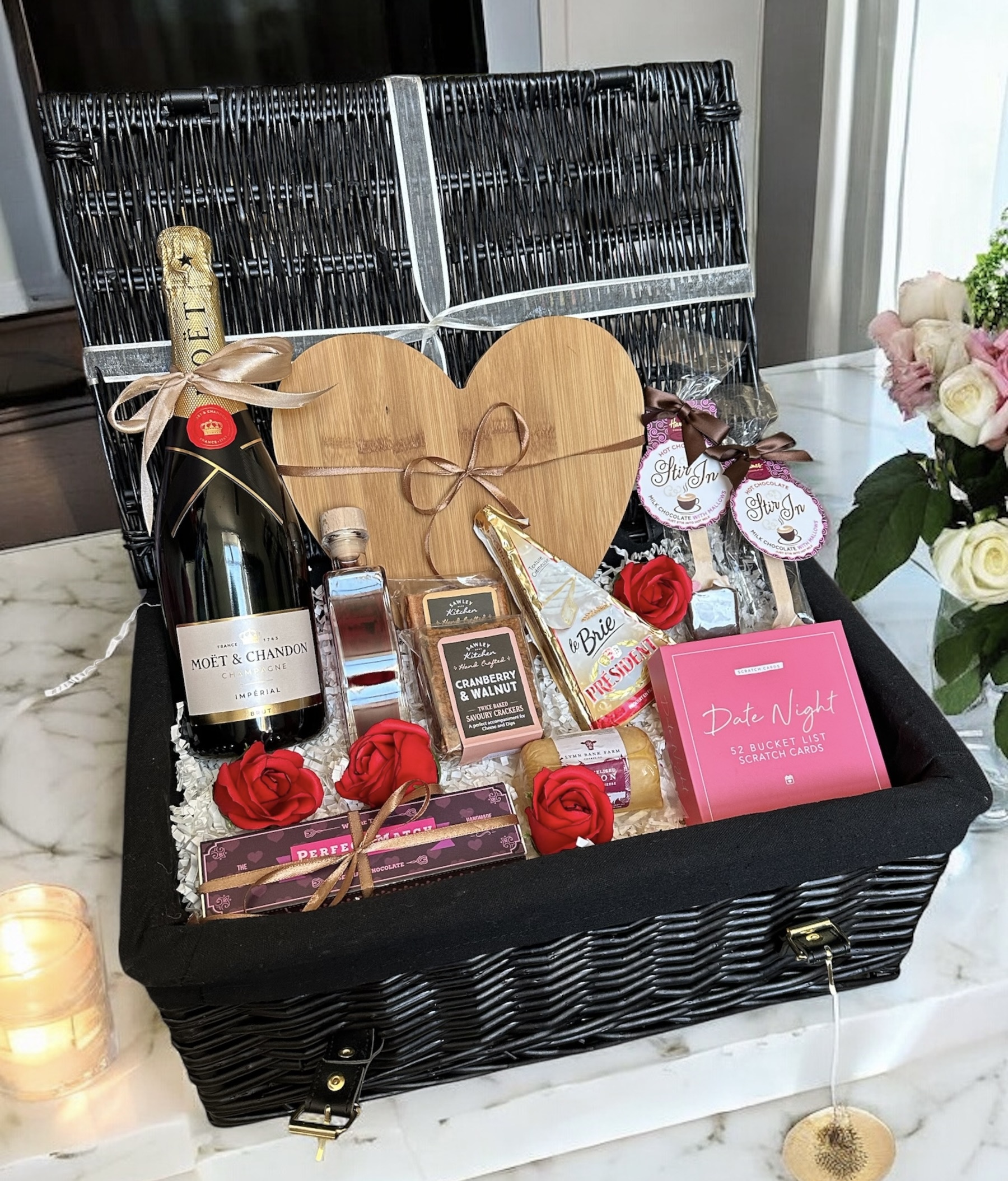 a basket with a bottle of wine and other items