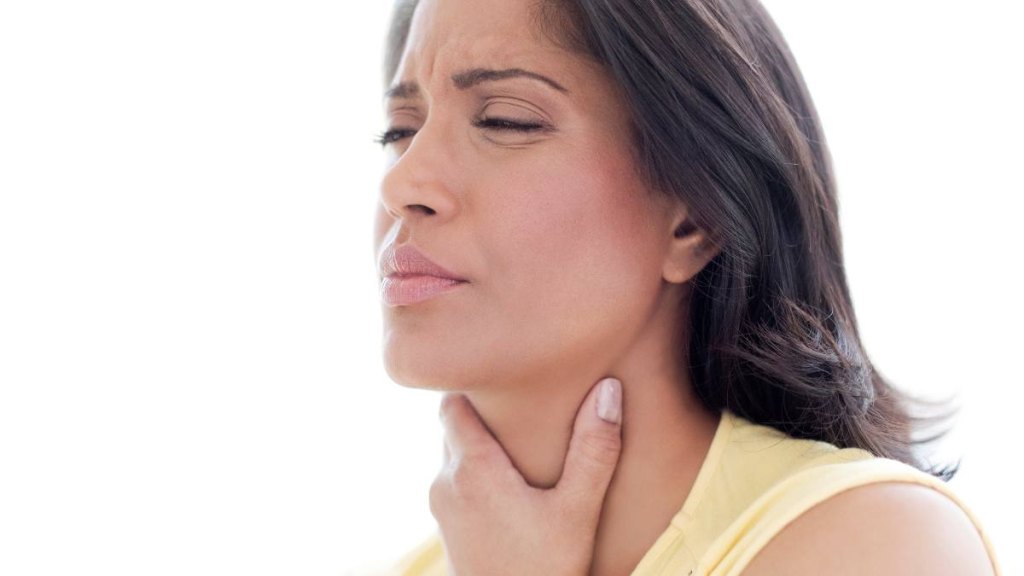 Woman with sore throat