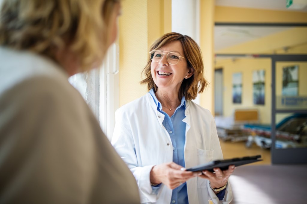 female doctor discussing informed consent for surgery with patient