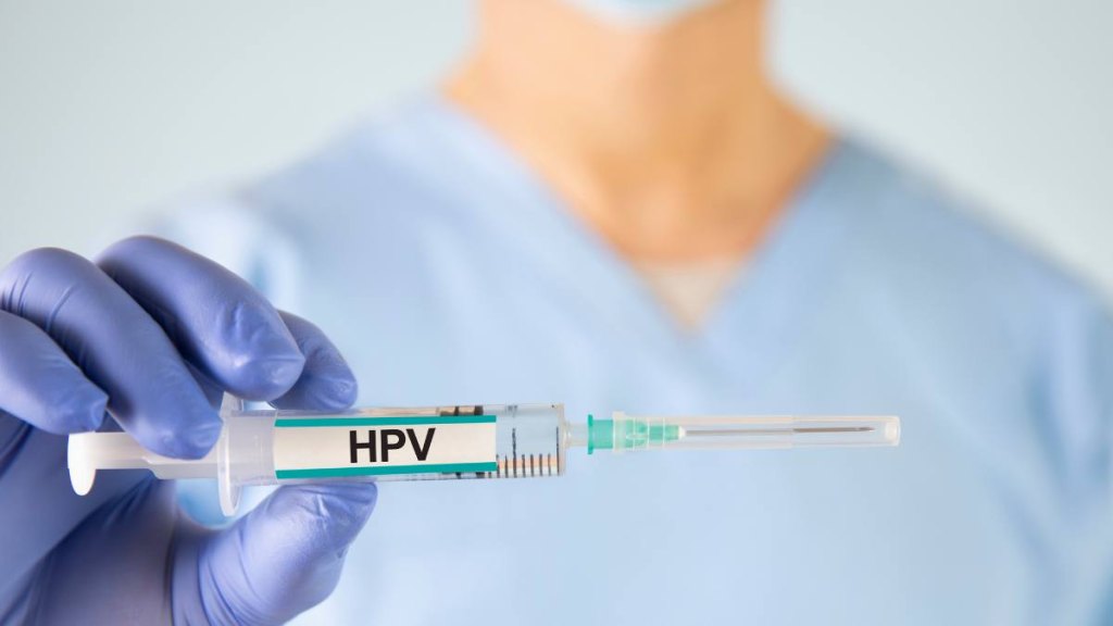 Doctor holding HPV vaccine