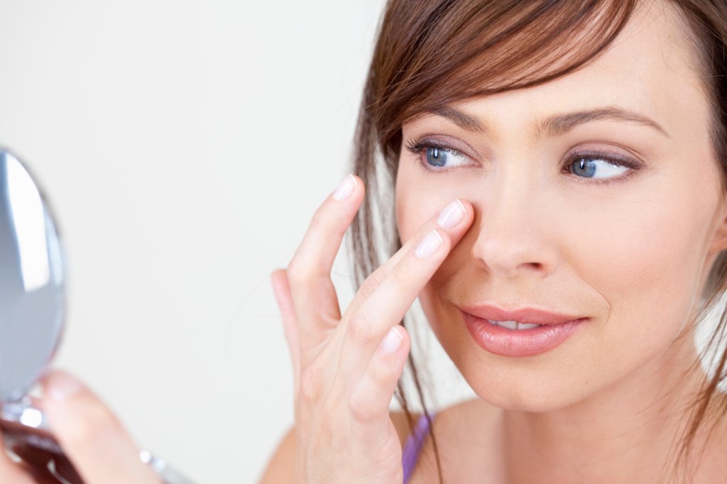 Woman applying primer