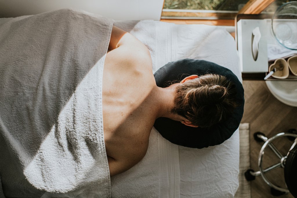 woman with chronic pain getting a massage as a natural remedy