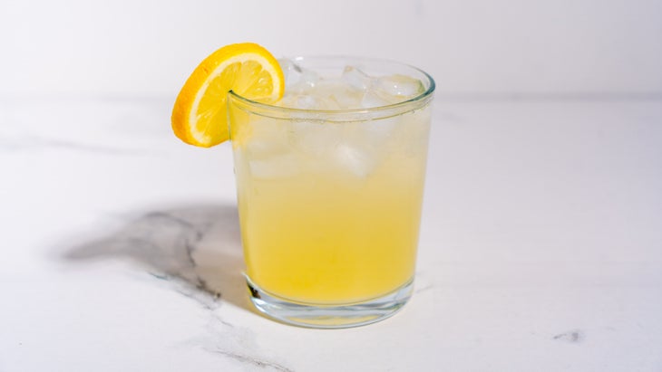 A glass of lemonade made with creatine, fresh-squeezed lemon juice, water, and agave.