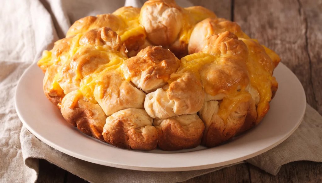 Savory herb and cheese pull-apart bread as part of a roundup of Super Bowl snack ideas