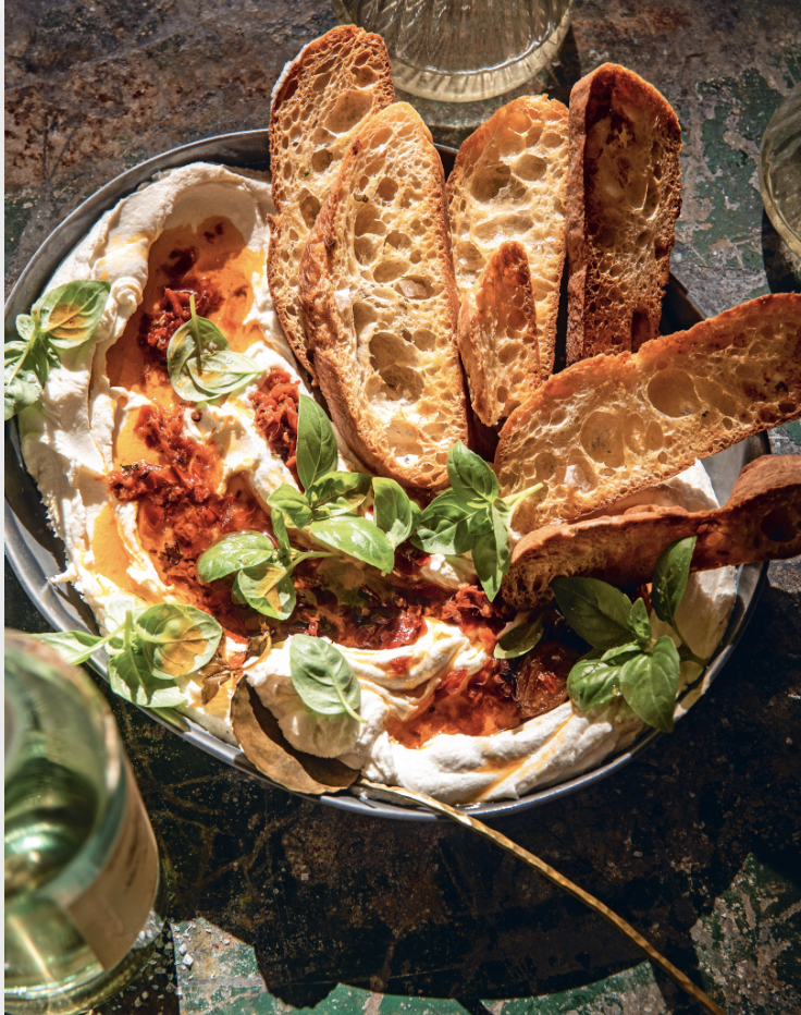 Whipped goat cheese and Calabrian chile oil dip as part of a roundup of Galentine's Day food ideas