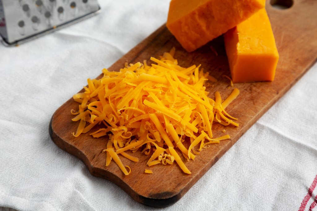 Freshly grated cheddar cheese for Blake Lively's mac and cheese hack