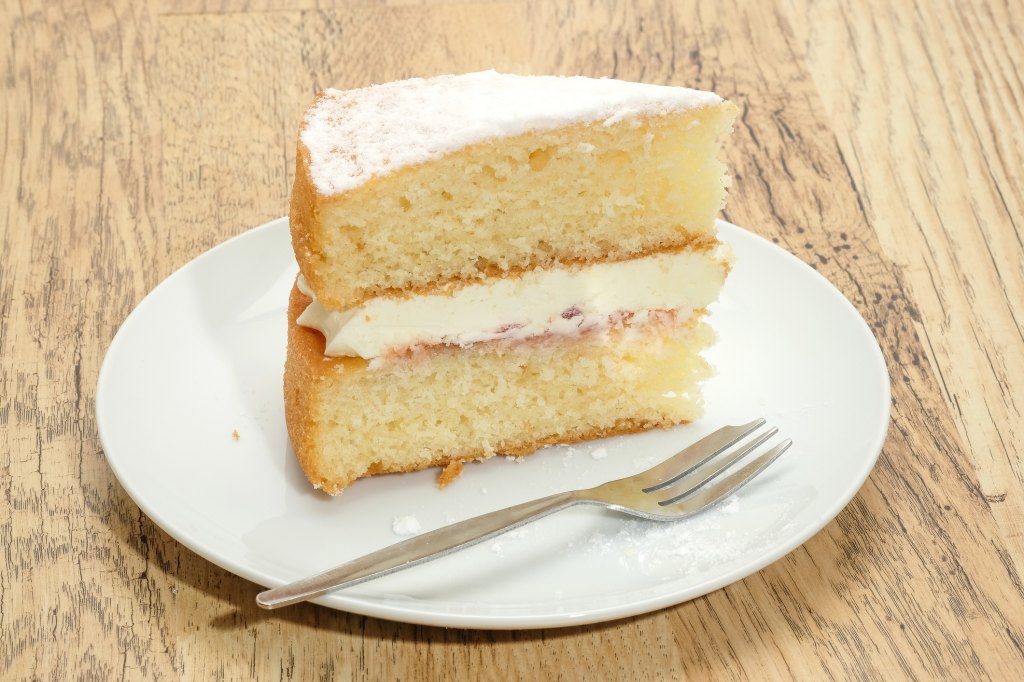 slice of Reese Witherspoon's sour cream cake on plate with fork