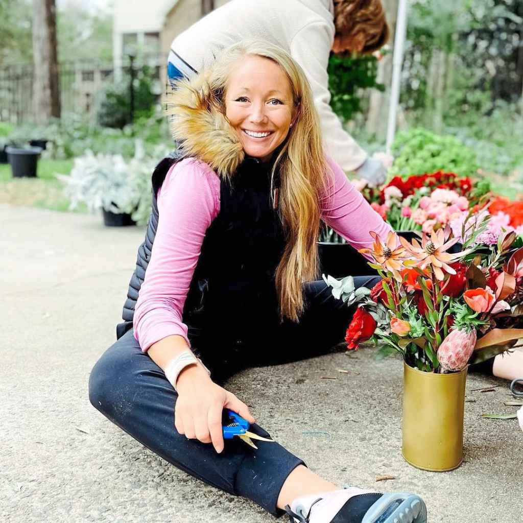 Ashley puts together arrangements of hydrangeas, roses and eucalyptus to be delivered to widows on Valentine’s Day