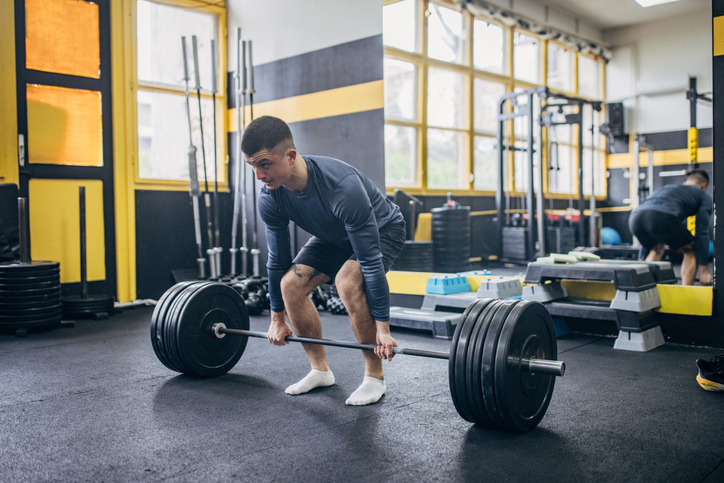 man preparing for deadlift | When to Take Pre Workout